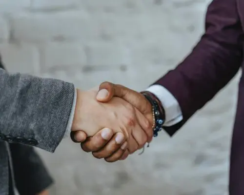 Men in suits shaking hands