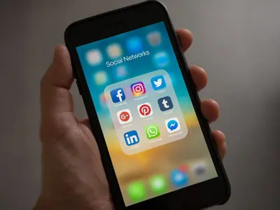 Social media app icons displayed on a smartphone.