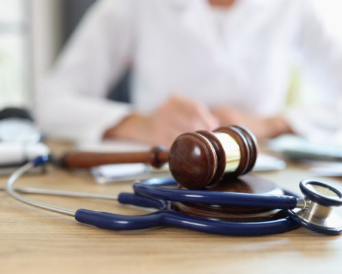 A judges gavel on a desk.