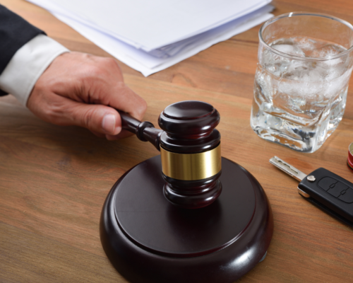 A judges gavel on a wooden table