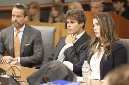 Alan Jackson, Fraser Bohm, and Jacqueline Sparagna seated in the courtroom.