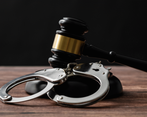 A judge’s gavel and a pair of handcuffs on a wooden surface, symbolizing the serious criminal charges and legal consequences involved in Los Angeles sex trafficking cases and the importance of a strong legal defense.
