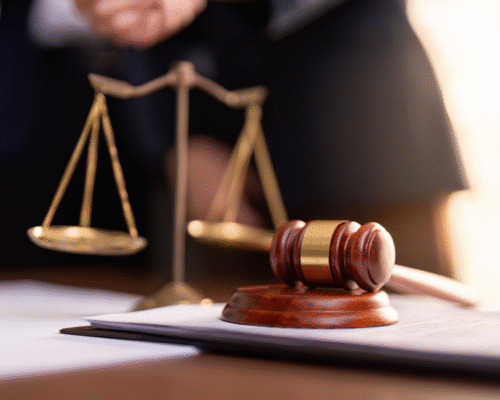 A judge’s gavel and scales of justice in the foreground, representing legal proceedings, fairness, and the importance of due process in high-stakes investigations.