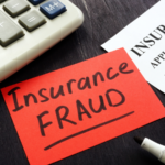 Insurance fraud on a post it on a desk